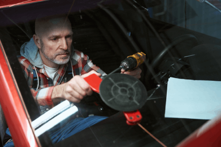 Vehicle windscreen specialist at work